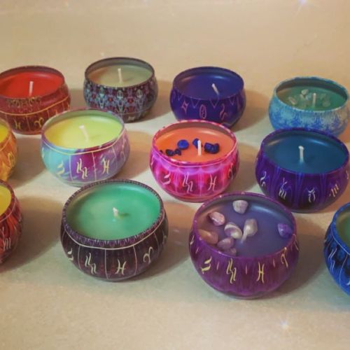 zodiac candles on table with various colours to choose from